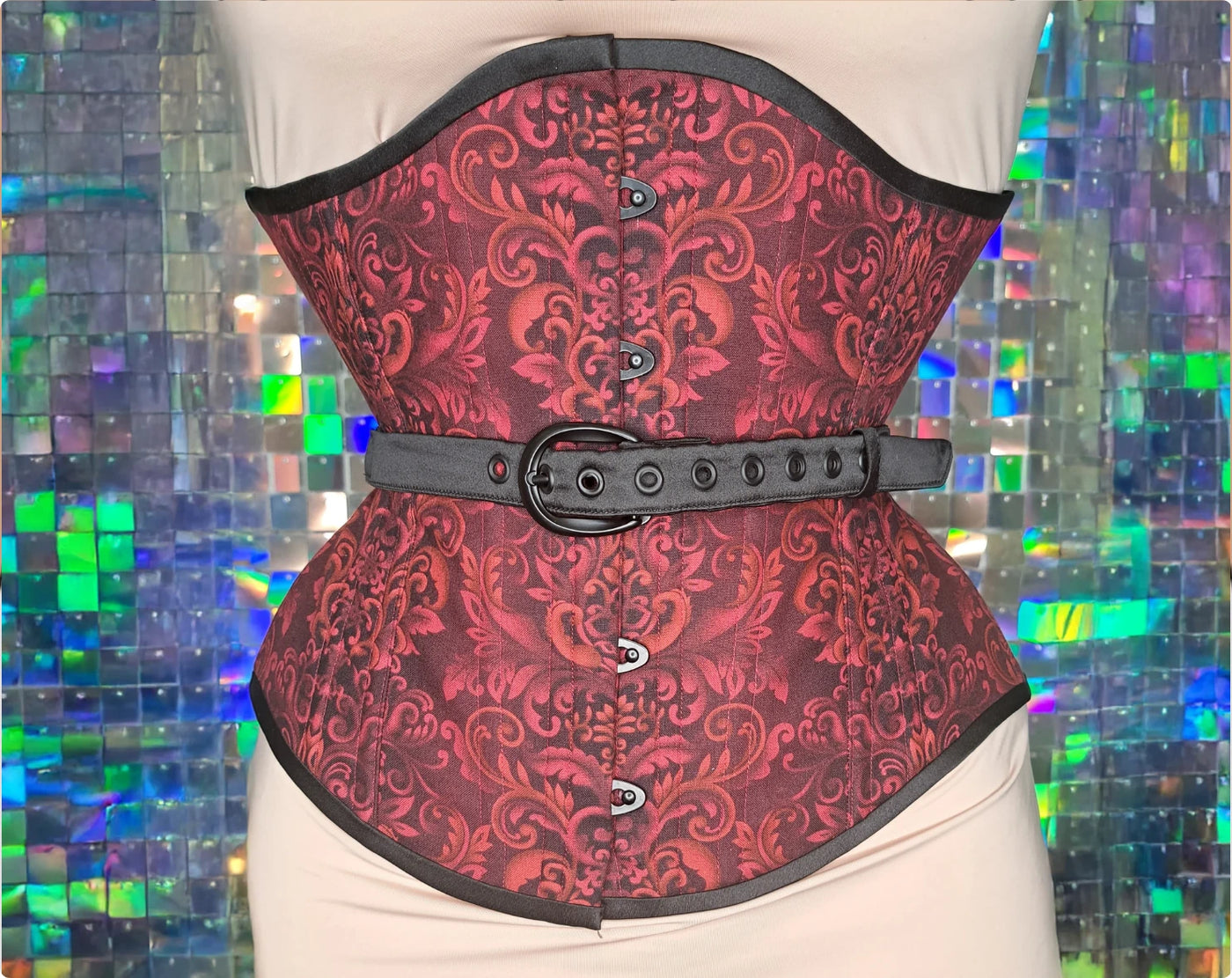 Red damask printed cotton underbust corset with black busk, fan lacing and contrasting accents — the finished corset